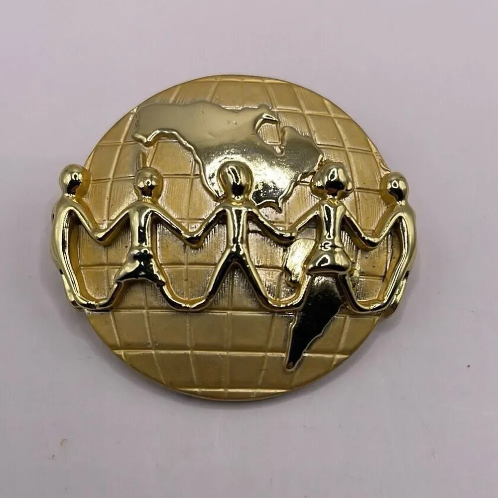 Signed AJC Globe Children Holding Hands Lapel Pin Brooch Goldtone Metal